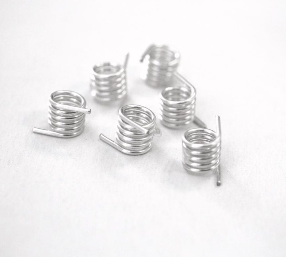 SMD air coils, inductors prepared for automated pick-and-place assembly, SMT adhesive dots, stable transport and positioning of inductive components in modern SMD electronics manufacturing. NEOTECH - Manufacturer of inductive components: coils and chokes, RFID components. Wire components. Manufacturer of machines and devices.SMD inductors, automatic assembly | SMD inductors, for automatic pick-and-place assembly, with applied SMT adhesive dots, stable transport and positioning of inductive components in modern SMD electronics production processes | NEOTECH - Manufacturer of inductive components. Coils, Chokes, Antennas, Heaters, Transformers. www.neotech.pl/induction | SMD inductors, automatic assembly | Induction Coil