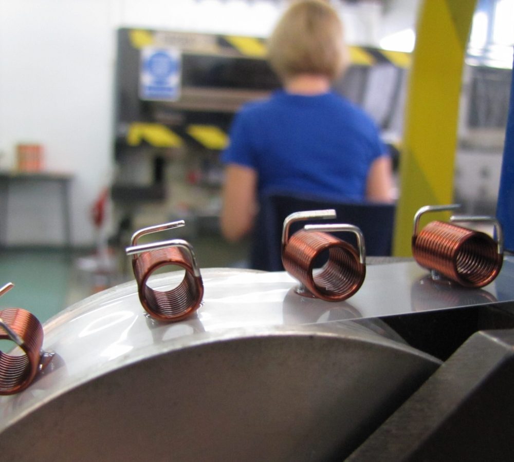 SMD air coils, inductors prepared for automated pick-and-place assembly, SMT adhesive dots, stable transport and positioning of inductive components in modern SMD electronics manufacturing. | Manufacturer of inductive components: coils and chokes, RFID components. Wire components. Manufacturer of machines and devices. Representative of Neosid Pemetzrieder GmbH &Co. KG. in Poland. |