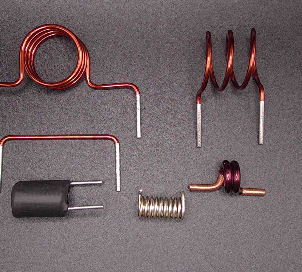 SMD air coils, inductors prepared for automated pick-and-place assembly, SMT adhesive dots, stable transport and positioning of inductive components in modern SMD electronics manufacturing. | NEOTECH - Manufacturer of inductive components: coils and chokes, RFID components. Wire components. Manufacturer of machines and devices.SMD inductors, automatic assembly | SMD inductors, for automatic pick-and-place assembly, with applied SMT adhesive dots, stable transport and positioning of inductive components in modern SMD electronics production processes | NEOTECH - Manufacturer of inductive components. Coils, Chokes, Antennas, Heaters, Transformers. www.neotech.pl/induction | SMD inductors, automatic assembly | Induction Coil