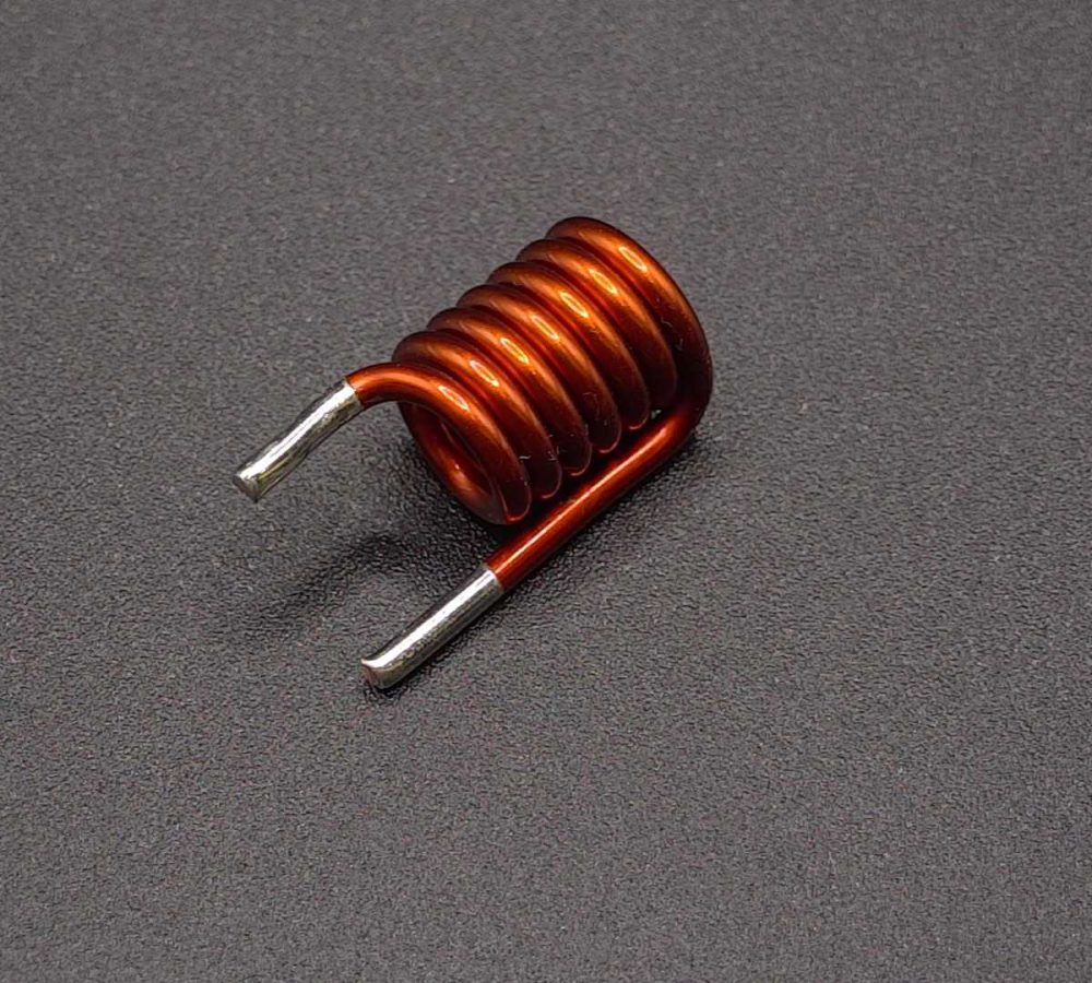 SMD air coils, inductors prepared for automated pick-and-place assembly, SMT adhesive dots, stable transport and positioning of inductive components in modern SMD electronics manufacturing. | NEOTECH - Manufacturer of inductive components: coils and chokes, RFID components. Wire components. Manufacturer of machines and devices.SMD inductors, automatic assembly | SMD inductors, for automatic pick-and-place assembly, with applied SMT adhesive dots, stable transport and positioning of inductive components in modern SMD electronics production processes | NEOTECH - Manufacturer of inductive components. Coils, Chokes, Antennas, Heaters, Transformers. www.neotech.pl/induction | SMD inductors, automatic assembly | Induction Coil