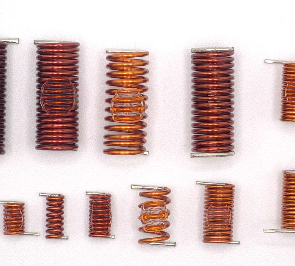 SMD air coils, inductors prepared for automated pick-and-place assembly, SMT adhesive dots, stable transport and positioning of inductive components in modern SMD electronics manufacturing.| NEOTECH - Manufacturer of inductive components: coils and chokes, RFID components. Wire components. Manufacturer of machines and devices.SMD inductors, automatic assembly | SMD inductors, for automatic pick-and-place assembly, with applied SMT adhesive dots, stable transport and positioning of inductive components in modern SMD electronics production processes | NEOTECH - Manufacturer of inductive components. Coils, Chokes, Antennas, Heaters, Transformers. www.neotech.pl/induction | SMD inductors, automatic assembly | Induction Coil