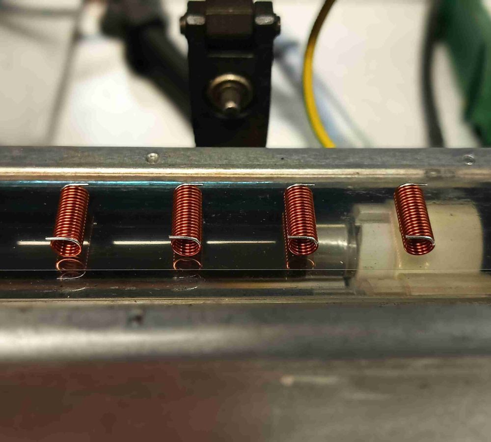 SMD air coils, inductors prepared for automated pick-and-place assembly, SMT adhesive dots, stable transport and positioning of inductive components in modern SMD electronics manufacturing. | Manufacturer of inductive components: coils and chokes, RFID components. Wire components. Manufacturer of machines and devices. Representative of Neosid Pemetzrieder GmbH &Co. KG. in Poland.SMD inductors, automatic assembly | SMD inductors for automatic pick-and-place assembly, with applied SMT adhesive dots, stable transport and positioning of inductive components in modern SMD electronics production processes | NEOTECH - Manufacturer of inductive components. Coils, Chokes, Antennas, Heaters, Transformers. www.neotech.pl/induction | SMD inductors, automatic assembly | Induction Coil