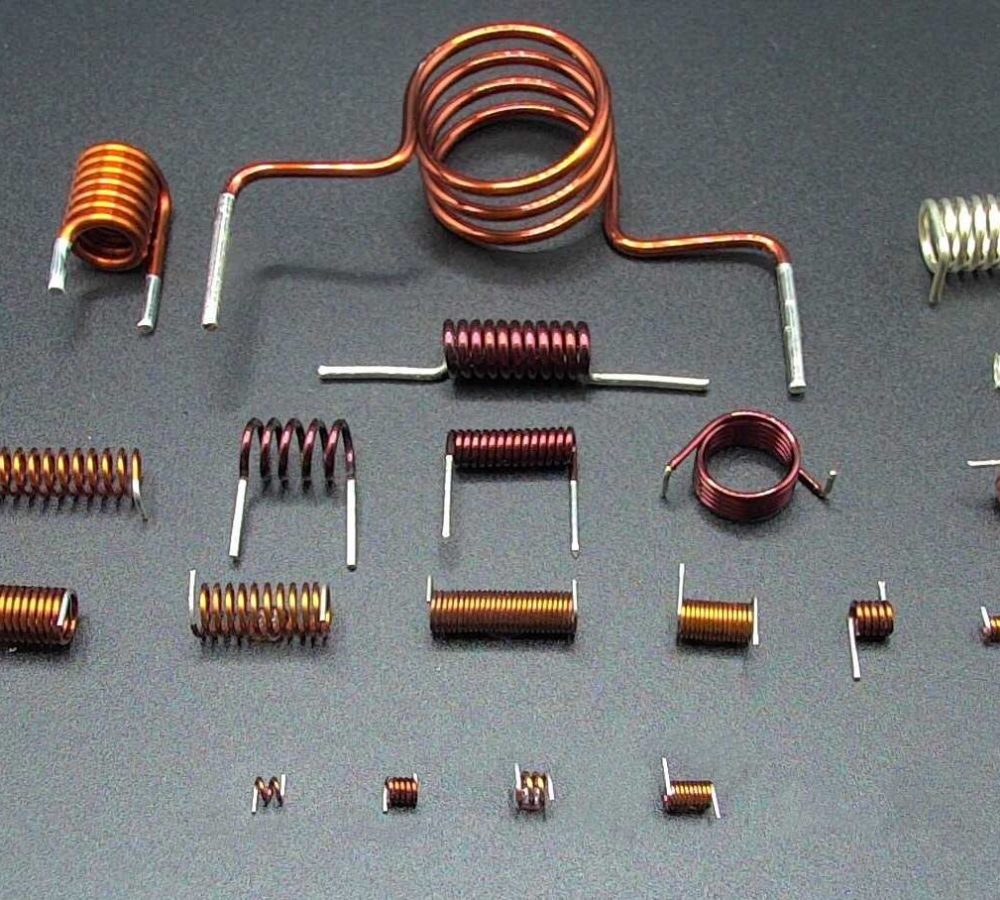 SMD air coils, inductors prepared for automated pick-and-place assembly, SMT adhesive dots, stable transport and positioning of inductive components in modern SMD electronics manufacturing. | NEOTECH - Manufacturer of inductive components: coils and chokes, RFID components. Wire components. Manufacturer of machines and devices.SMD inductors, automatic assembly | SMD inductors, for automatic pick-and-place assembly, with applied SMT adhesive dots, stable transport and positioning of inductive components in modern SMD electronics production processes | NEOTECH - Manufacturer of inductive components. Coils, Chokes, Antennas, Heaters, Transformers. www.neotech.pl/induction | SMD inductors, automatic assembly | Induction Coil